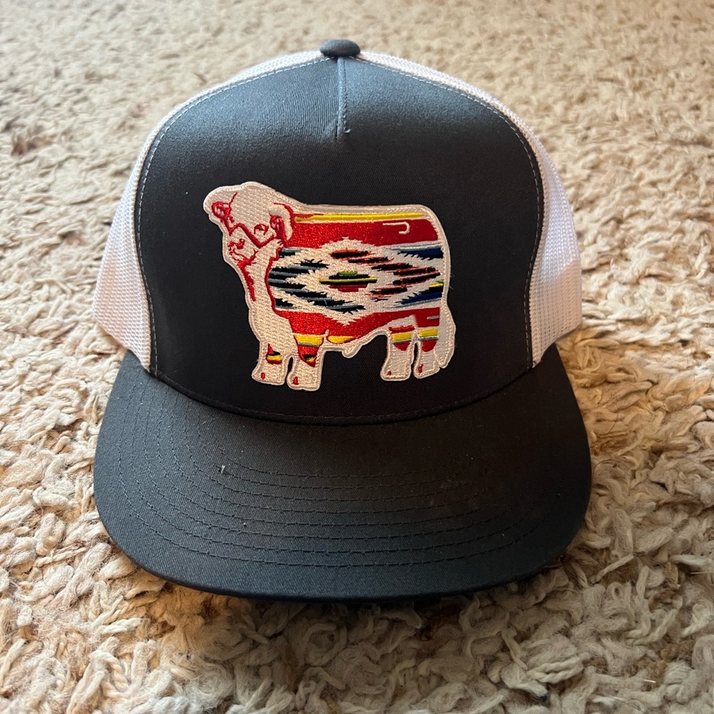 Black and White Trucker Hat with Colorful Cow Patch